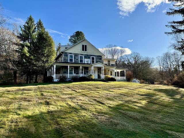 view of front of home with a front lawn and covered porch