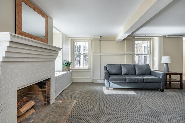 carpeted living area featuring a fireplace