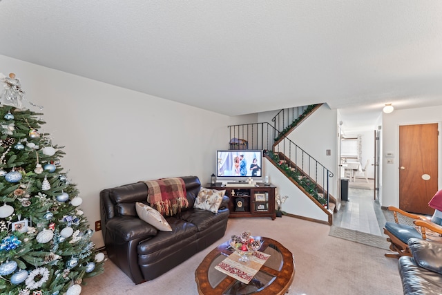 living room featuring carpet flooring and a textured ceiling