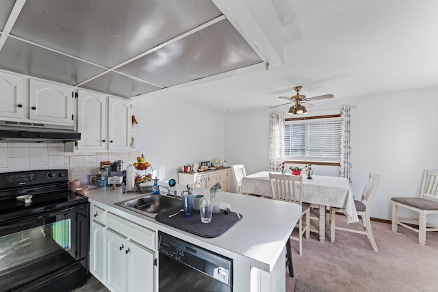 kitchen featuring light carpet, kitchen peninsula, white cabinetry, and black appliances