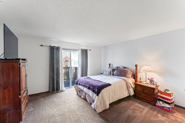 bedroom featuring carpet flooring, a textured ceiling, and access to outside