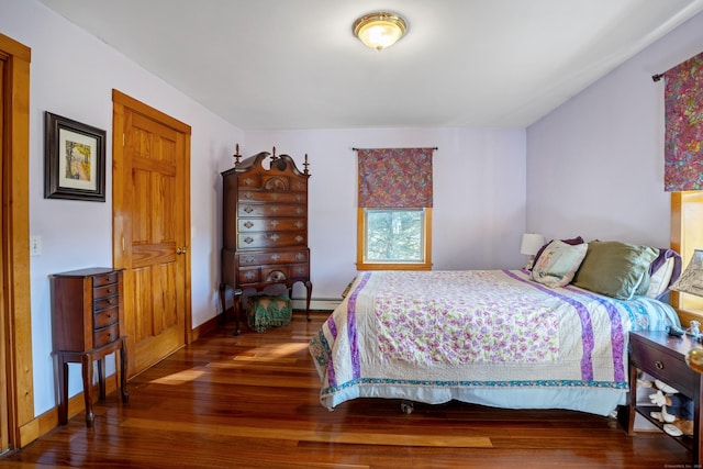 bedroom with baseboard heating and dark wood-type flooring