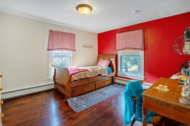 bedroom with a textured ceiling, dark hardwood / wood-style flooring, and a baseboard radiator