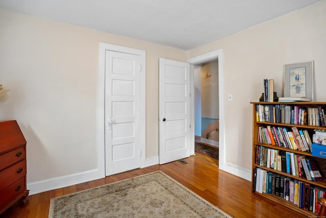 interior space with hardwood / wood-style floors