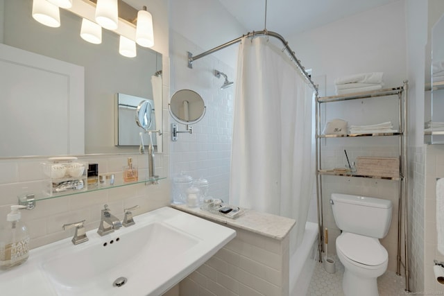 full bathroom featuring sink, tile patterned flooring, decorative backsplash, toilet, and tile walls