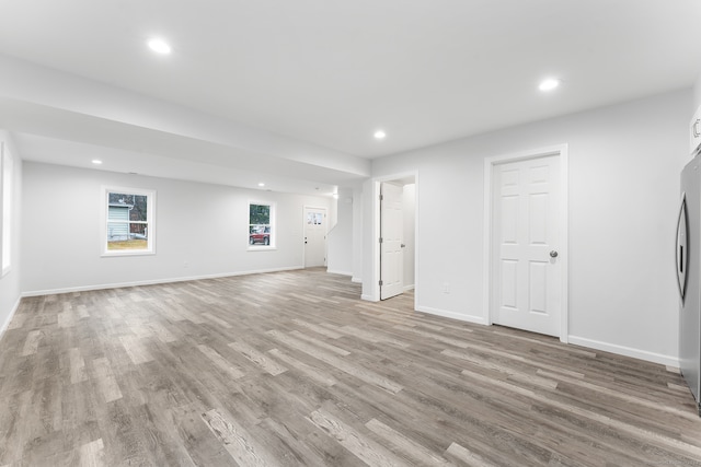 unfurnished living room featuring light hardwood / wood-style flooring