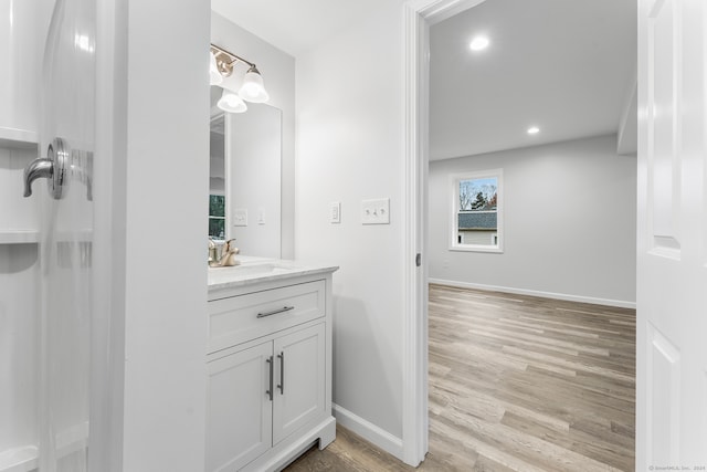 bathroom featuring hardwood / wood-style flooring and vanity