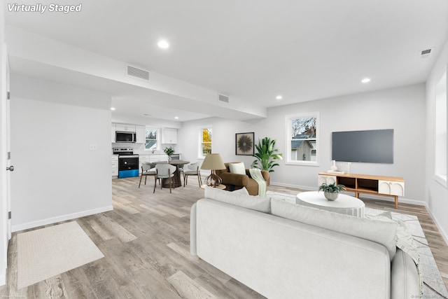 living room featuring light wood-type flooring