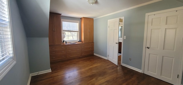 unfurnished bedroom featuring crown molding and dark wood-type flooring