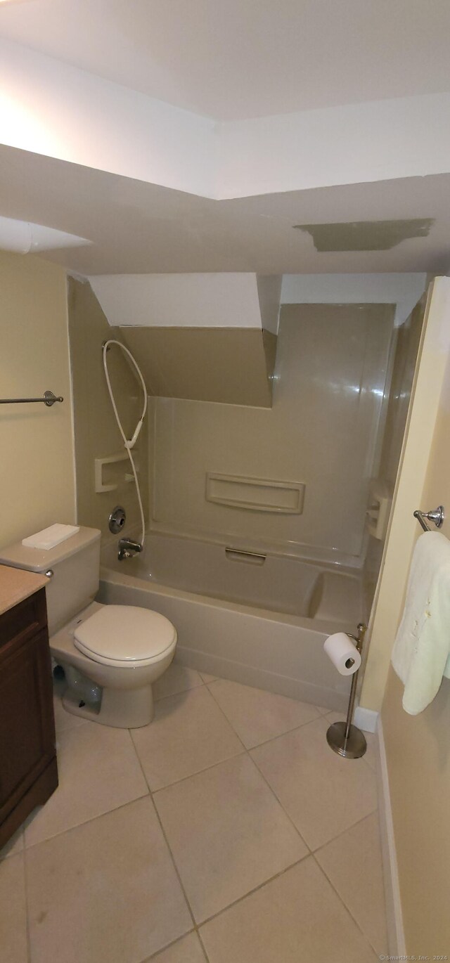 full bathroom featuring tile patterned flooring, shower / tub combination, vanity, and toilet