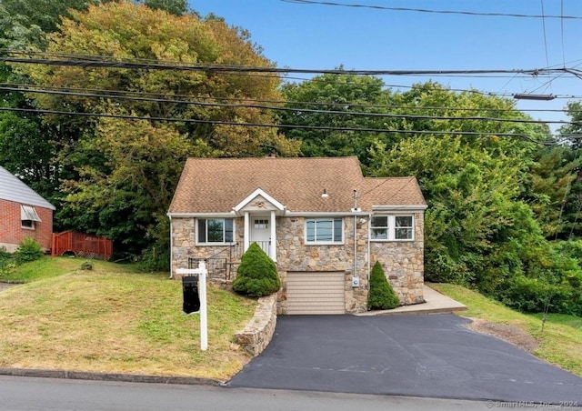 view of front facade featuring a garage and a front yard