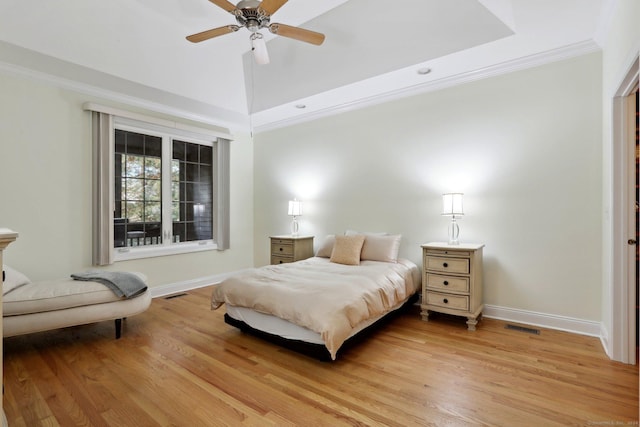 bedroom featuring ceiling fan, light hardwood / wood-style flooring, and crown molding