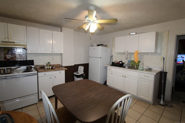 kitchen with decorative backsplash, white cabinetry, white appliances, and ceiling fan