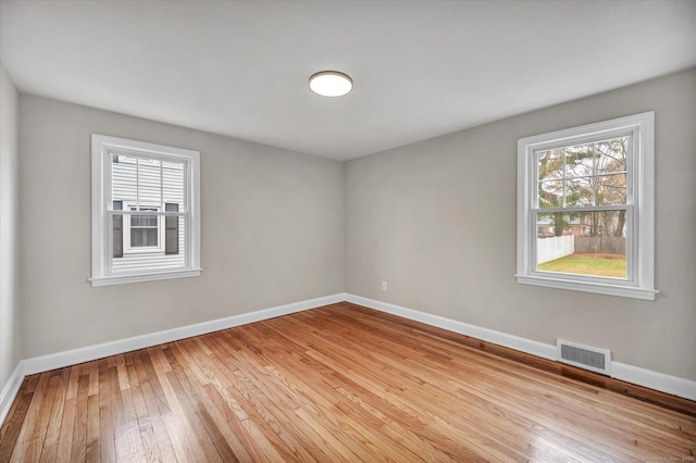 spare room featuring light hardwood / wood-style flooring