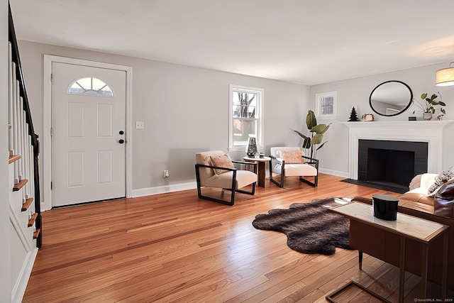 living room featuring light hardwood / wood-style floors and a wealth of natural light