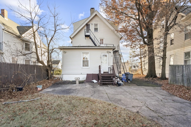 rear view of house featuring a patio