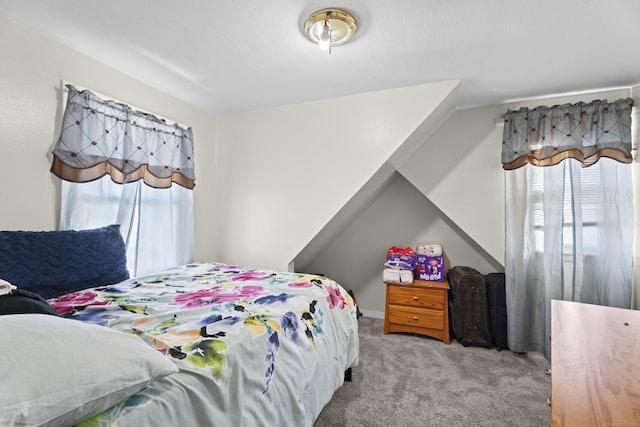 bedroom featuring light carpet