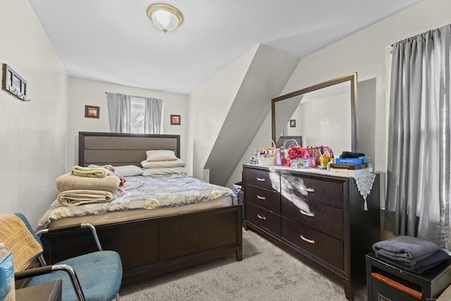 carpeted bedroom featuring vaulted ceiling