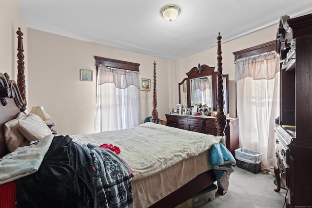 bedroom featuring light colored carpet