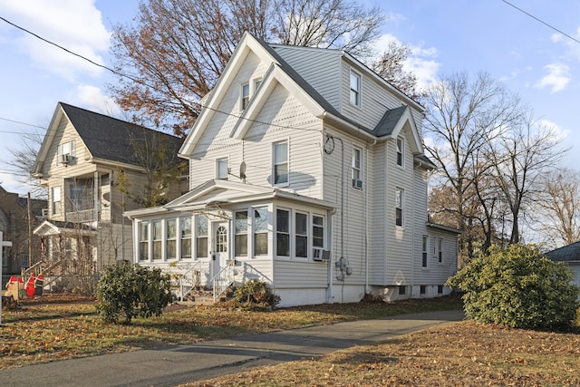 view of home's exterior featuring a sunroom