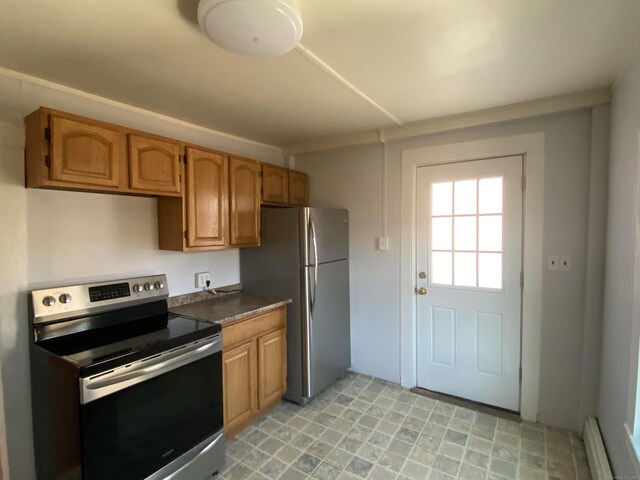 625 N Main St, Norwich, CT 06360 - kitchen featuring stainless steel appliances, a baseboard heating unit, dark countertops, and brown cabinetry