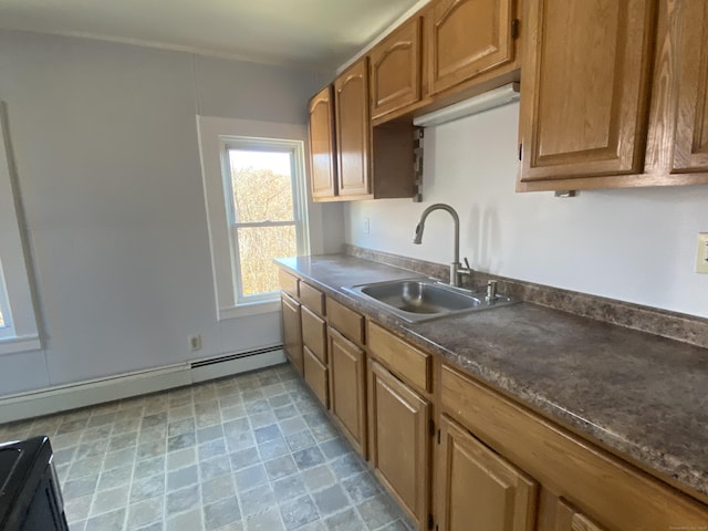 625 N Main St, Norwich, CT 06360 - kitchen featuring a sink, a baseboard radiator, brown cabinets, and dark countertops