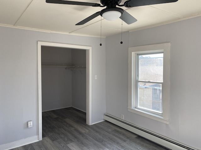 625 N Main St, Norwich, CT 06360 - unfurnished bedroom featuring a baseboard heating unit, crown molding, a closet, dark wood-style flooring, and baseboards