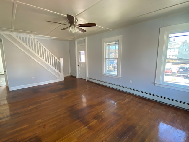 interior space with dark hardwood / wood-style flooring, a baseboard radiator, and ceiling fan