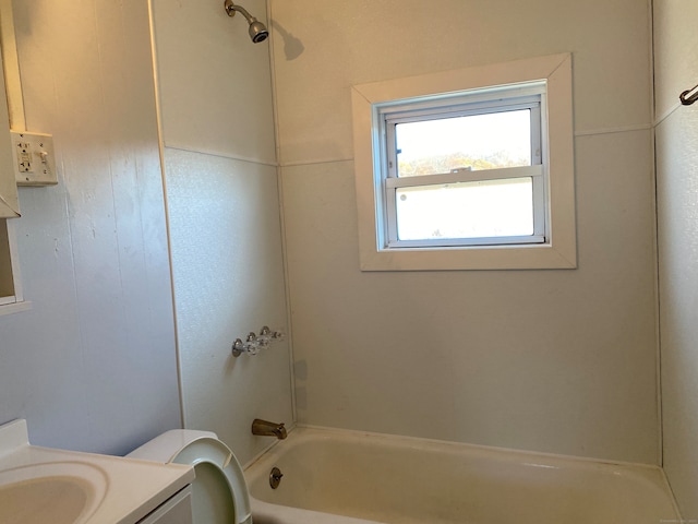 full bathroom with washtub / shower combination, vanity, and toilet