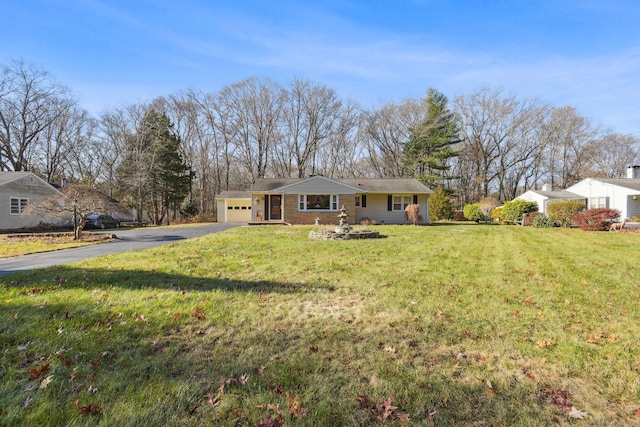 view of front facade with a front yard and a garage