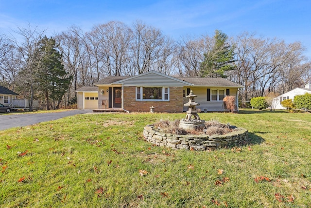 ranch-style home with a garage and a front lawn