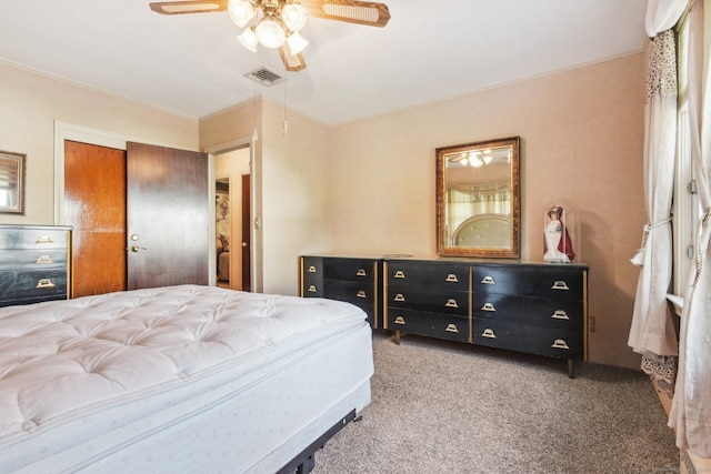 carpeted bedroom featuring a closet and ceiling fan