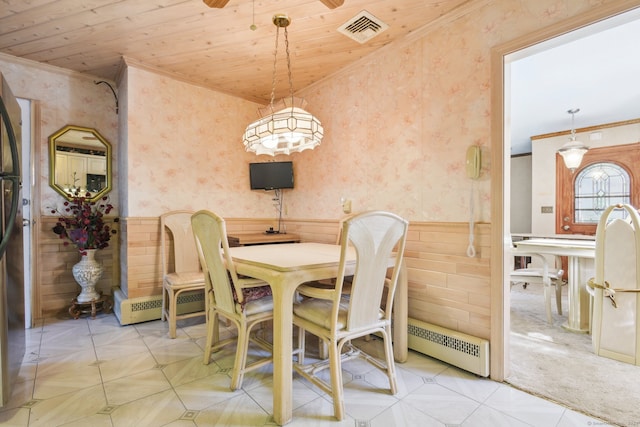 dining area featuring a baseboard radiator, crown molding, and wood ceiling