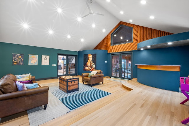 living room featuring french doors, light hardwood / wood-style floors, high vaulted ceiling, and ceiling fan