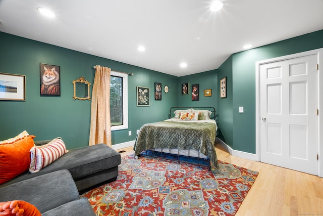 bedroom with hardwood / wood-style flooring