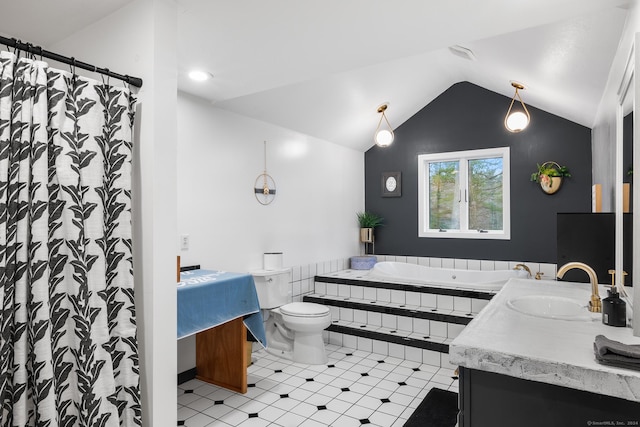 bathroom with vanity, vaulted ceiling, and toilet