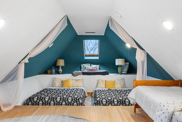 bedroom with lofted ceiling with skylight