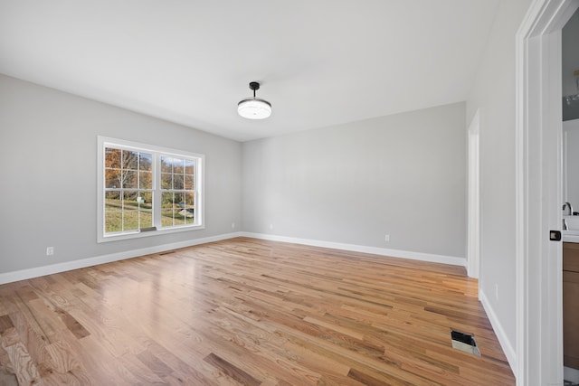 spare room featuring light hardwood / wood-style flooring