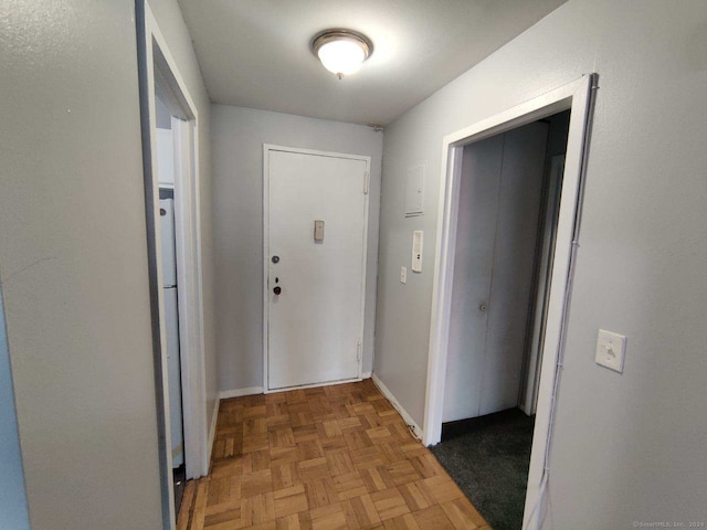 corridor featuring parquet floors