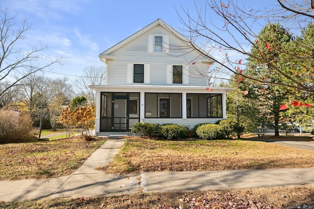 view of property featuring a sunroom