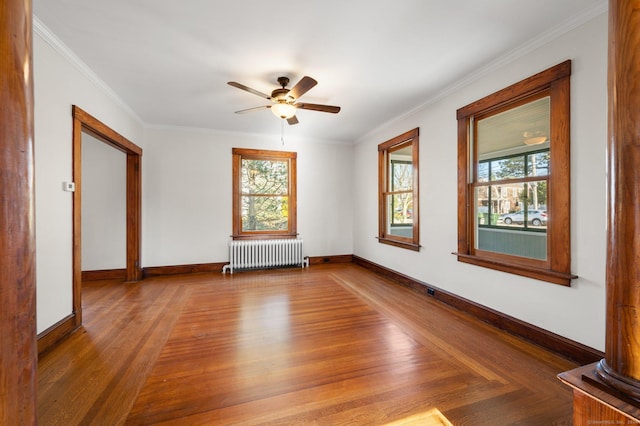 46 Lyme St, Old Lyme, CT 06371 - empty room featuring radiator heating unit, wood finished floors, a ceiling fan, and crown molding