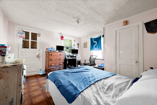 bedroom with dark parquet floors