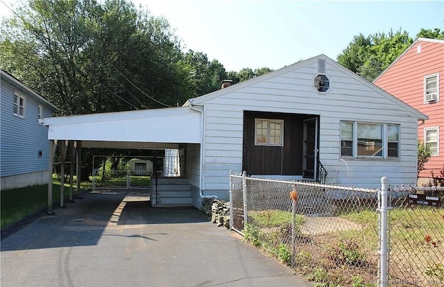 view of front of property with a carport