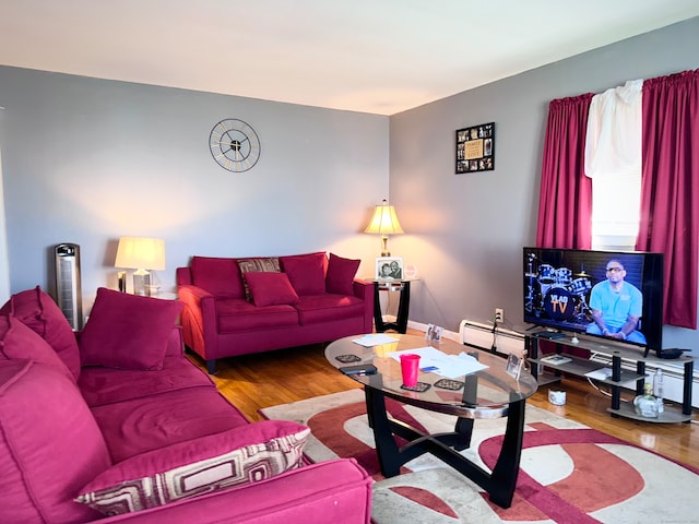 living room featuring hardwood / wood-style floors and baseboard heating