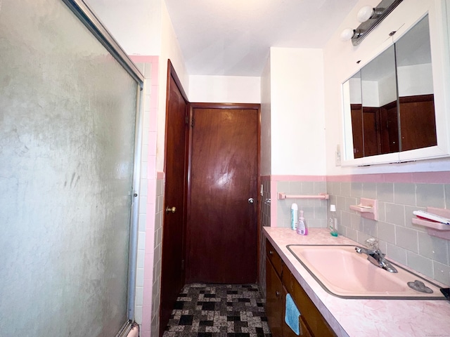 bathroom featuring vanity and walk in shower