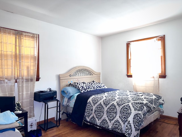 bedroom featuring dark hardwood / wood-style flooring