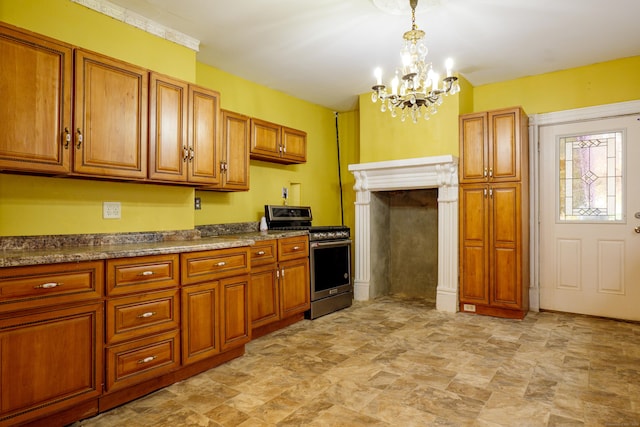 kitchen featuring stainless steel range, pendant lighting, and a notable chandelier