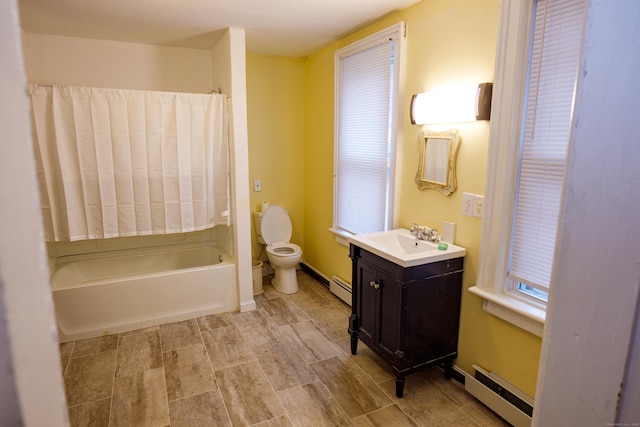 bathroom featuring vanity, a baseboard radiator, and toilet