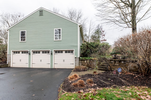 view of property exterior with a garage