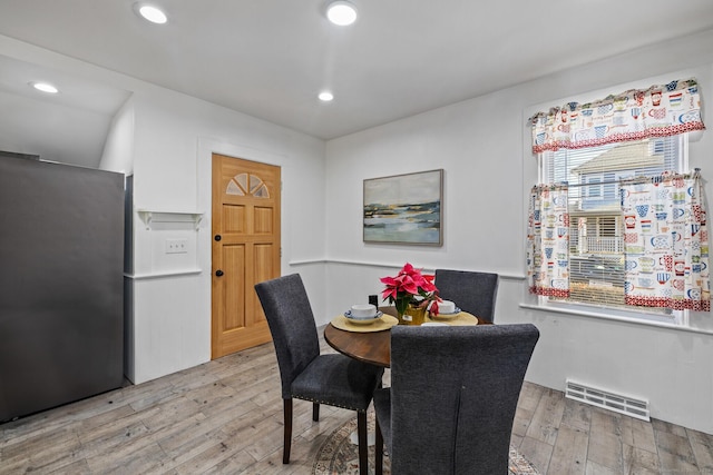 dining area with light hardwood / wood-style flooring